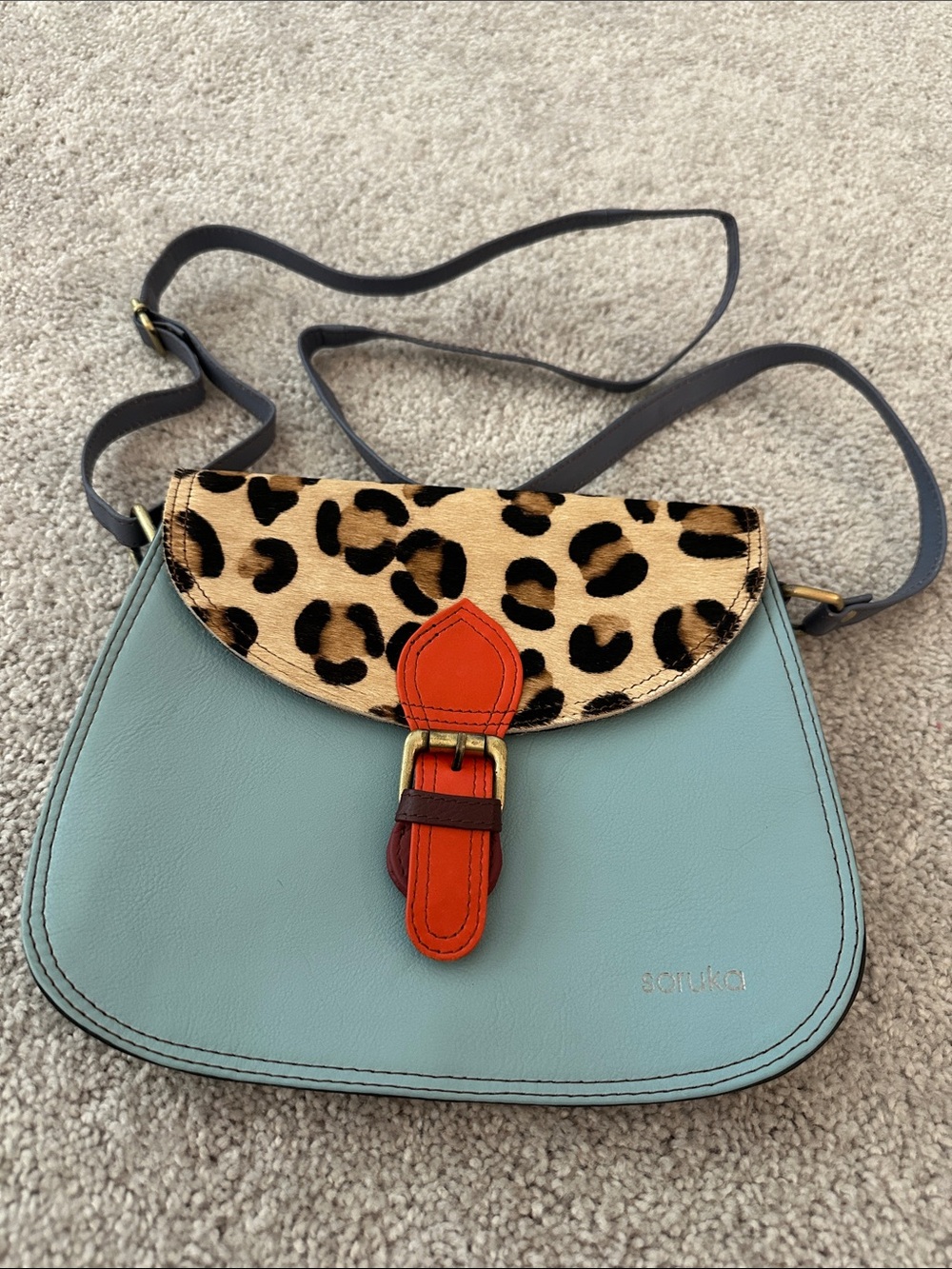 Soruka Light Blue Crossbody with Leopard Flap and Orange Buckle Accent